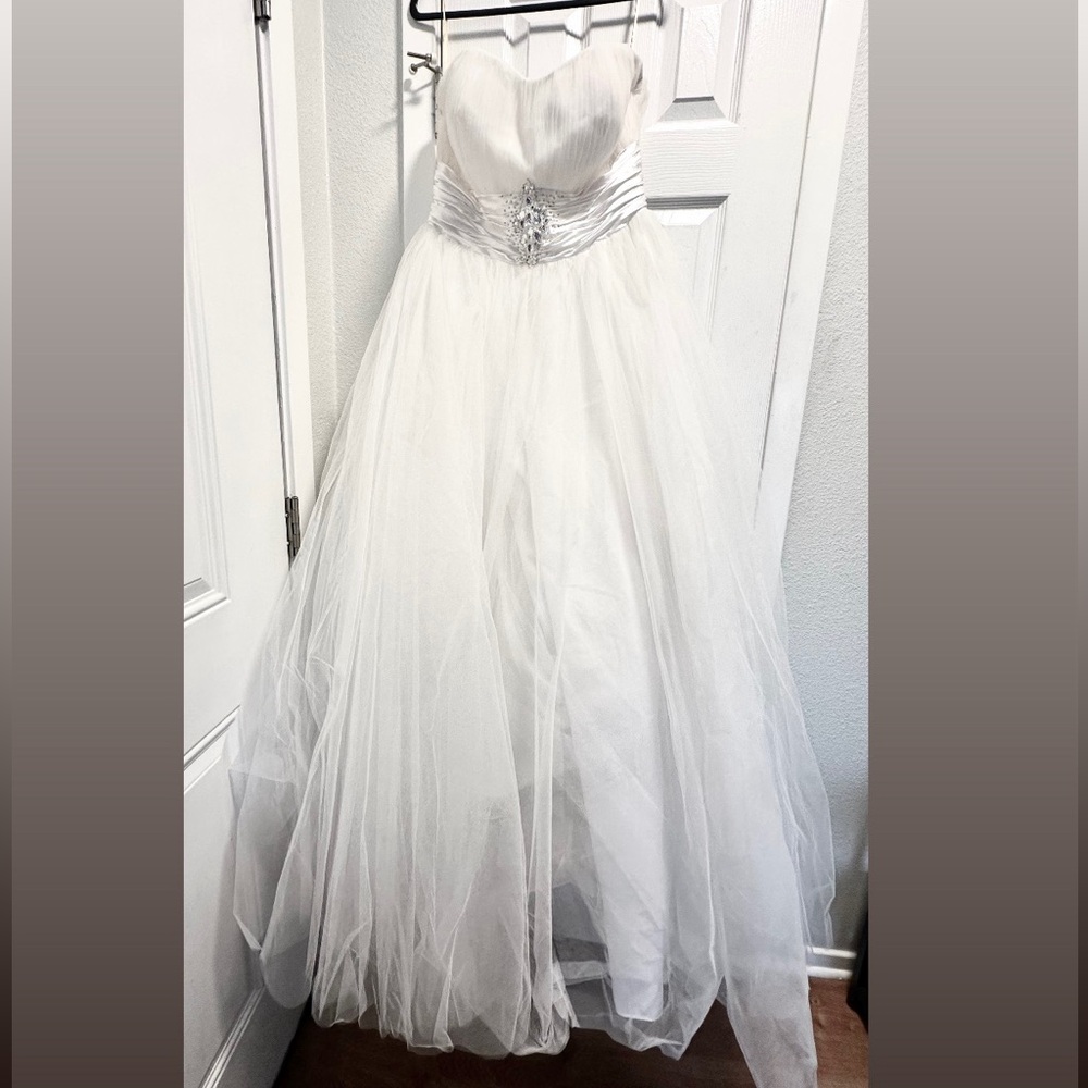 White tulle A-line midi dress with silver silk and rhinestone embellishments.